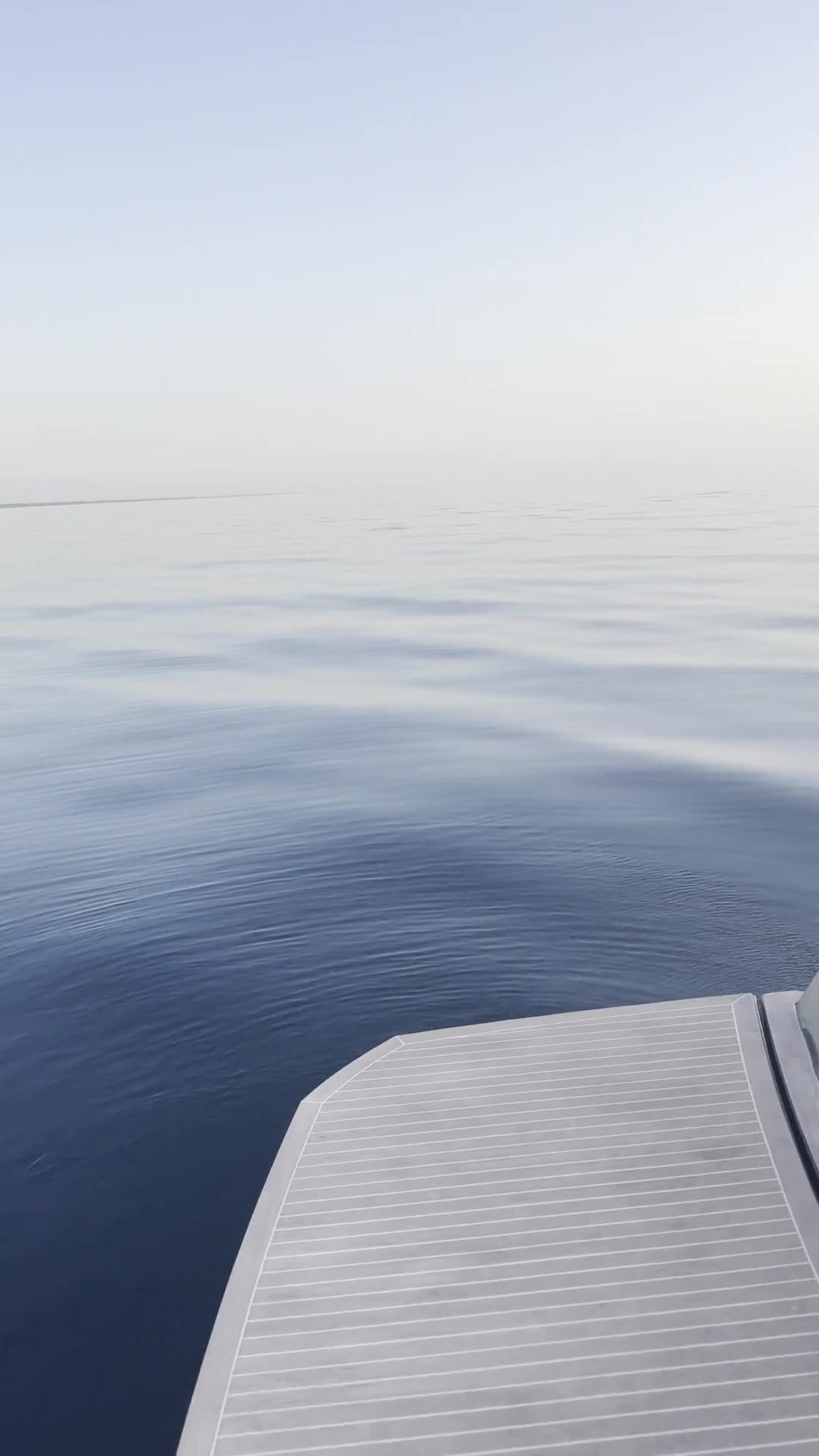 Still water off the bow at dusk