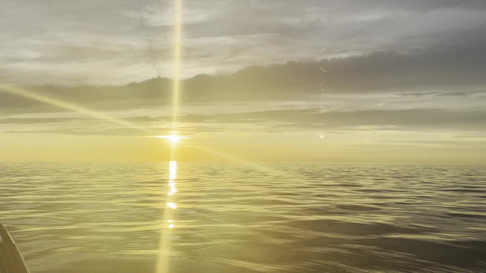 The sun laying a path across the water